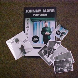 Purchase the fabulous new JOHNNY MARR LP “Playland”, and you`ll get a bunch of free Johnny Marr goodies to take home with it! (7″ “Easy Money” single…set of postcards…sticker…and poster!!). While limited supplies last!