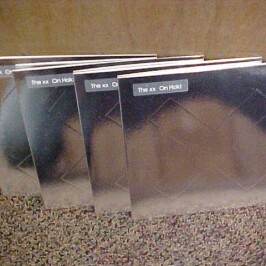 We have 4 copies of the brand new 7″ single from The xx, “On Hold”.